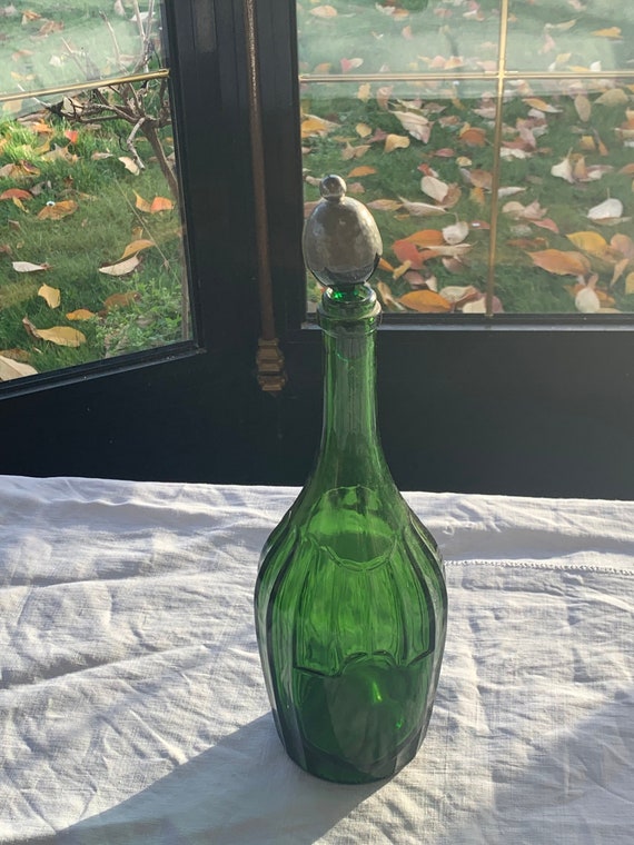 Bottle, green glass decanter, pewter stopper and vintage green glass