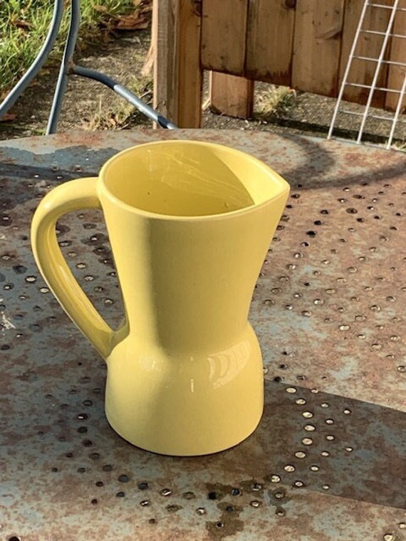 Jug, Saint Clement pitcher vintage 1950/1960 in enameled ceramic, yellow, stamped and numbered, made in France, number 7821/16