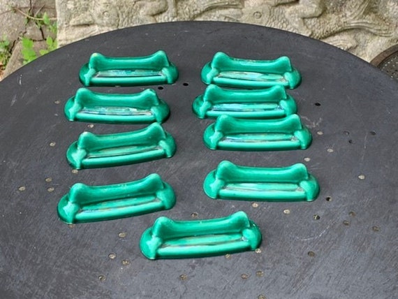 9 knife holders in green enamelled ceramic, design and art deco