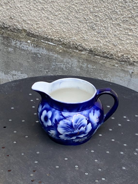 Milk jug with blue and gold peony motif, made in England, numbered 505 yH, antique and collector's item