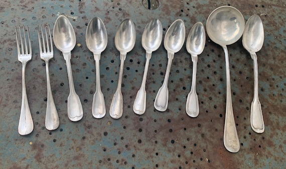 Set of 10 silver metal cutlery, hallmark 84, composed of 6 tablespoons including a monogram, a ladle, a sauce spoon, two mismatched forks