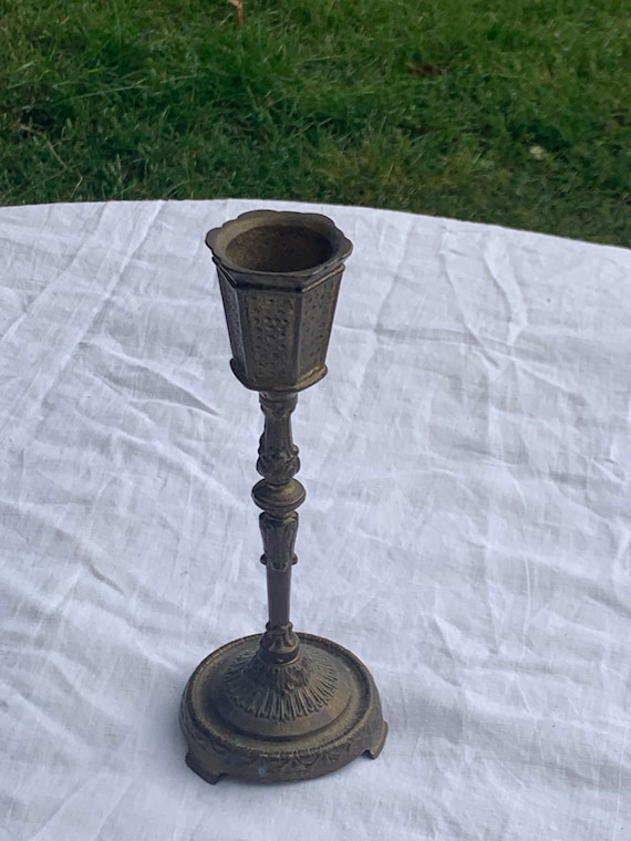 Old chiseled brass candlestick. for candle or candle, old assembly, screwed parts, collector