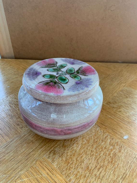 Glazed ceramic pot vintage floral pattern.
