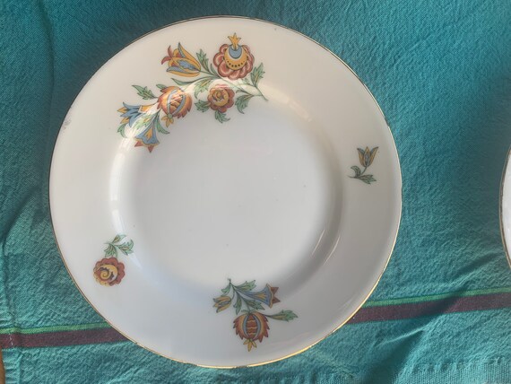 6 small plates in stamped Limoges porcelain, with an art deco floral motif