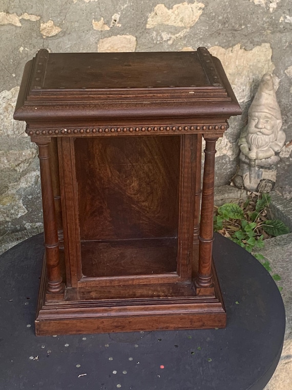 Old display case or reliquary from the 19th century,certainly in walnut, in the shape of a temple, 4 round chiseled columns