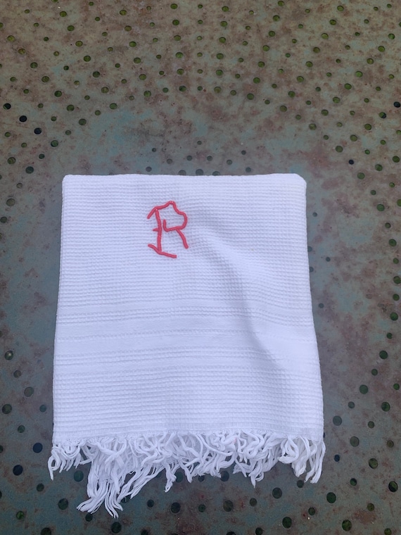 White honeycomb towel with initial R embroidered with red thread, old