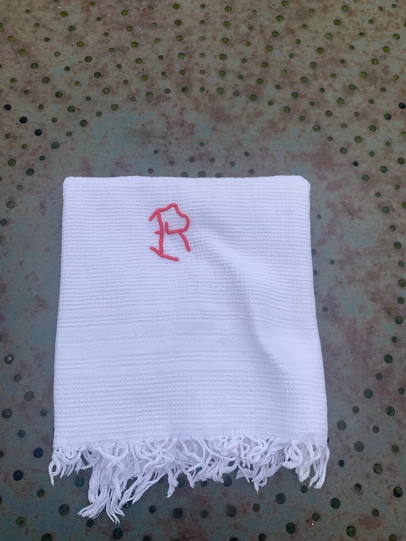 White honeycomb towel with initial R embroidered with red thread, old