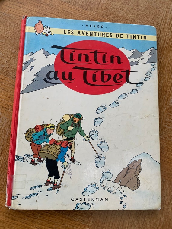 Two vintage and collector tintin albums. Tintin in tibet printed in Belgium in 1966 and the temple of the sun published in 1984