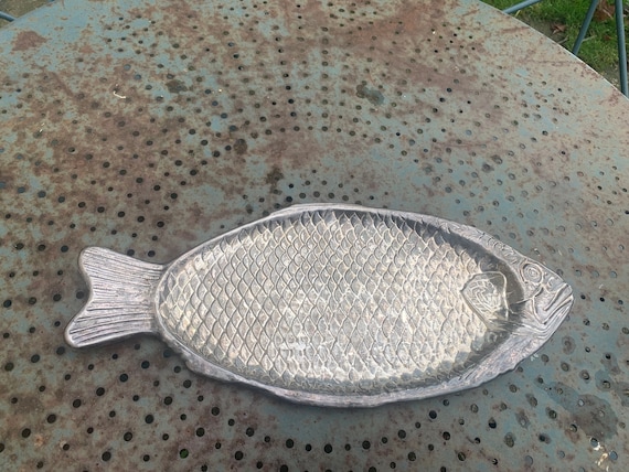 Serving dish in the shape of a fish, salmon, in silver-colored metal