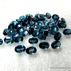 5x7mm London Blue Topaz Faceted Oval Gemstone, London blue topaz Oval Faceted gemstone, Blue Topaz Faceted Oval Gemstone