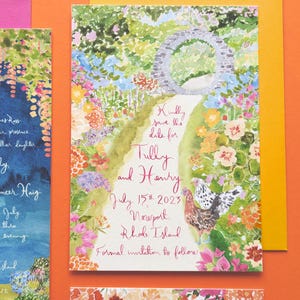 May include: Save the date card featuring a watercolour illustration of a garden path leading to a stone archway. The text reads "Kindly save the date for Tully and Henry, July 15th, 2023, Newport, Rhode Island. Formal invitation to follow."