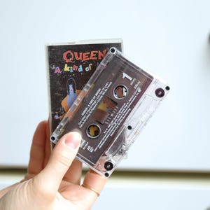 vintage 1980's rock band tape turned refrigerator art magnet