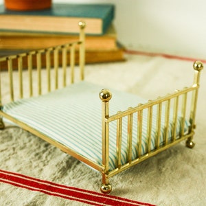 May include: A set of three ceramic mugs with a speckled, matte finish. The mugs are in shades of cream, light gray, and dark gray. Each mug has a simple, minimalist design, perfect for coffee or tea.