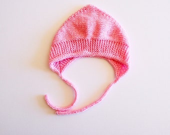 Newborn pink bonnet hand knit with pure wool