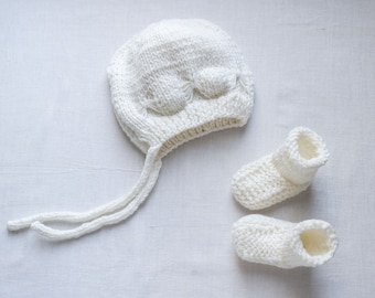 Newborn hand knit white “butterfly” bonnet and stay-on socks