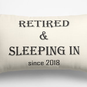 May include: A white pillow with black text that reads "Retired & Sleeping In since 2018".