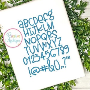May include: A white fabric with blue embroidery of the alphabet, numbers, and punctuation marks. The text "Imaginary Friend" is at the top of the fabric. The fabric is on a green leafy background. Seven sizes are listed: 0.5", 0.75", 1", 1.25", 1.5", 1.75", and 2".