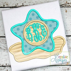 May include: A turquoise blue star with white polka dots and a wooden circle with a monogram in the center. The star is on top of a tan shell shape.