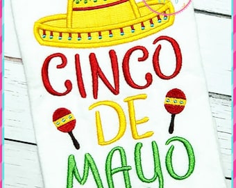 May include: Embroidered design featuring a yellow sombrero, maracas, and the text "Cinco de Mayo" in red, yellow, and green.