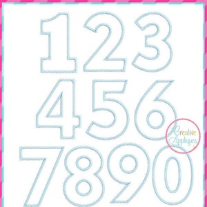 May include: A set of ten blue outlined numbers, 1 through 0, in a white square. The numbers are in three rows, with the numbers 1, 2, and 3 in the top row, 4, 5, and 6 in the middle row, and 7, 8, 9, and 0 in the bottom row. The text "7 sizes: 2"/3"/4"/5"/6"/7"/8"" is below the numbers. The text "Creative Appliques" is in the bottom right corner of the square.