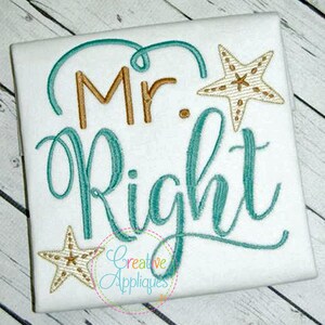 May include: Embroidered design on a white t-shirt featuring the text "Mr. Right" in teal cursive with two gold starfish accents.