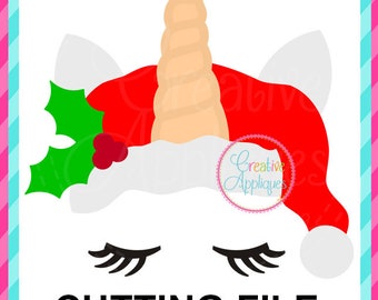 May include: A white unicorn with closed eyes wearing a red Santa hat with green holly and a red berry. The unicorn has a long, curled, beige horn. The text "CUTTING FILE" is below the unicorn.