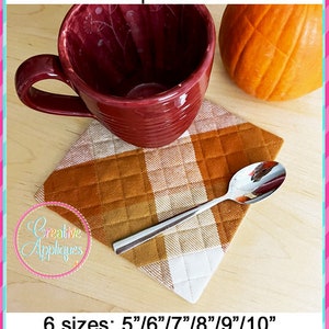 May include: A red mug sits on a brown and white checkered hot pad holder. The hot pad is available in six sizes: 5", 6", 7", 8", 9", and 10". The text "Creative Appliques" is visible in the lower left corner of the image.