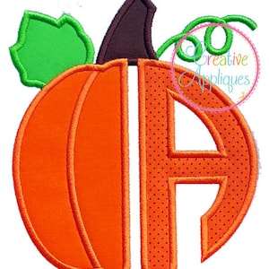 May include: Orange pumpkin with a brown stem and green leaves. The pumpkin is cut out to reveal the letter "A" in a dotted pattern.
