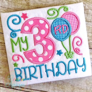 May include: Embroidered design featuring a pink and white polka dot number 3, the words "My 3rd Birthday", and two blue and white gingham balloons with green swirls.