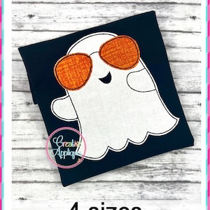 May include: Embroidered design of a white ghost wearing orange sunglasses on a black fabric. The design is available in four sizes.  The text "BEAN STITCH" and "4 sizes" is also visible in the image.