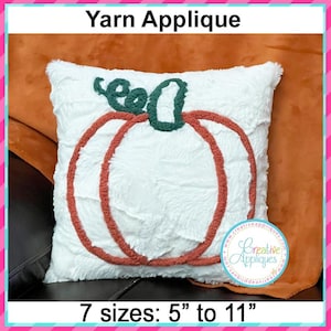 May include: White pillow with a yarn applique of an orange pumpkin. The pumpkin is outlined in orange yarn and has a green yarn stem. The pillow is on a brown surface. The text "Yarn Applique" is at the top of the image. The text "7 sizes: 5" to 11" is at the bottom of the image.