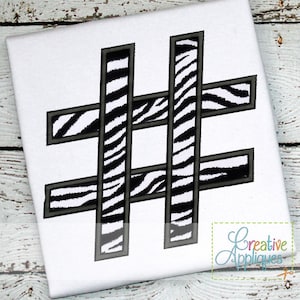May include: Black and white zebra print embroidery design of the hashtag symbol. The design is outlined in black.