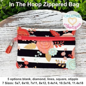 May include: A zippered bag with a floral pattern and black and white stripes. The bag has a red zipper and a tassel. The text "In The Hoop Zippered Bag" is at the top. The bag is approximately 7 inches wide and 5 inches tall.