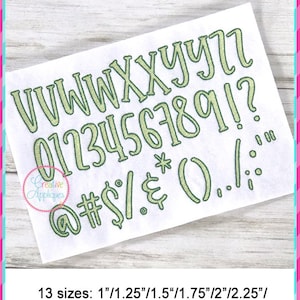 May include: A set of green embroidered letters, numbers, and symbols in a handwritten font style. The letters include V, W, X, Y, Z, and the numbers include 0, 1, 2, 3, 4, 5, 6, 7, 8, 9. The symbols include @, #, $, %, &, *, (, ), ., /, !, and ?. The text below the embroidered letters, numbers, and symbols reads "13 sizes: 1"/1.25"/1.5"/1.75"/2"/2.25"/2.5"/2.75"/3"/3.25"/3.5"/3.75"/4"