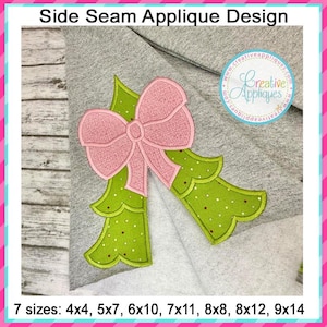 May include: A green Christmas tree applique with a pink bow. The applique is designed to be sewn onto a side seam of a garment. The applique is available in 7 sizes: 4x4, 5x7, 6x10, 7x11, 8x8, 8x12, and 9x14 inches.