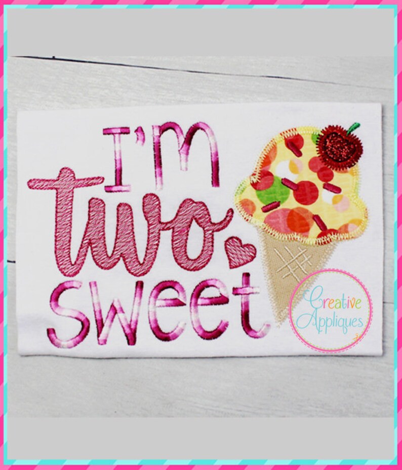 May include: Embroidered design on a white fabric with the text "I'm two sweet" in pink and a pink and yellow ice cream cone with a red cherry on top.