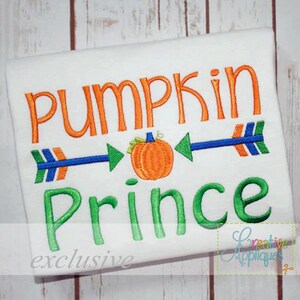 May include: White t-shirt with orange "PUMPKIN" text above green "Prince" text. A small orange pumpkin is centered between two blue arrows with green arrowheads. The word "exclusive" is at the bottom.