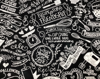 Friendship cotton fabric by half yard, words: “Food, Friendship, Fun”, “A Sprinkle of Compassion”  letters in white, black background