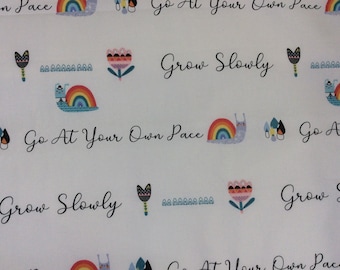 Nursery cotton fabric with words, by 1/2 yard,  “Go at your Own Pace”, “Grow Slowly”, animals, rainbows & flowers, red, yellow,  blue, white
