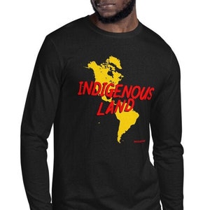 May include: Black long-sleeve shirt with a yellow world map and the text "Indigenous Land" in red.
