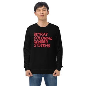 May include: Black sweatshirt with red text that reads "BETRAY COLONIAL GENDER SYSTEMS".