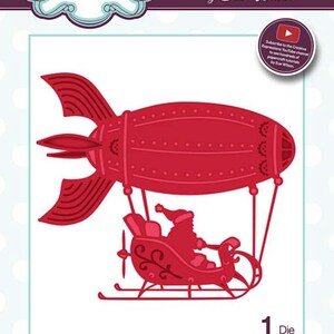 May include: Red metal die cut of a Santa Claus flying in a red airship with a festive design. The die measures 9.4 inches by 8.3 inches. The die is part of a collection called "Festive - Industrial Chic - Flying Santa".