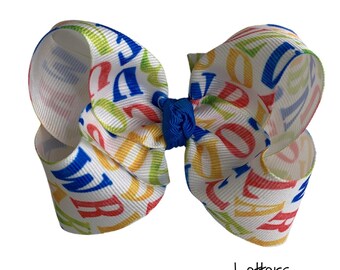 Lazo para el pelo con letras para la vuelta al cole