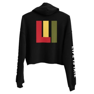 Knit crop pullover hoodie featuring on both sleeves "life is irie" text.  On back featuring the icon graphic in Reggae colors of red, gold, and green.