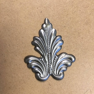 Decorative metal leaf emblem.  Lightweight metal onlay.