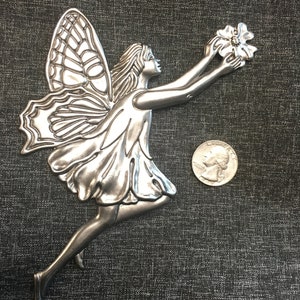 Metal Whimsical Fairy holding flower