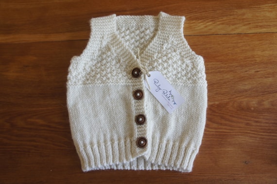 cream baby vest