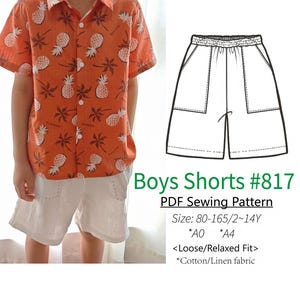 Può includere: Una camicia arancione a maniche corte con un motivo ad ananas abbinata a pantaloncini bianchi. L'immagine mostra anche un modello di pantaloncini da ragazzo, con il testo "Boys Shorts #817" e i dettagli delle taglie.