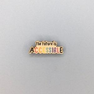 Può includere: Segno in legno con il testo "the future is ACCESSIBLE" in colori arcobaleno.