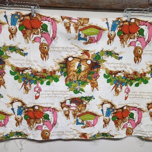 May include: White fabric with a repeating pattern of Peter Rabbit characters. The fabric features Peter Rabbit and his friends in various scenes, including gardening, playing, and enjoying the outdoors. The fabric is printed with the text "The Tale of Peter Rabbit" and "Beatrix Potter".